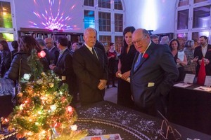 Arthur Quenneville, Margo Picard and David Angus admiring silent auction displays